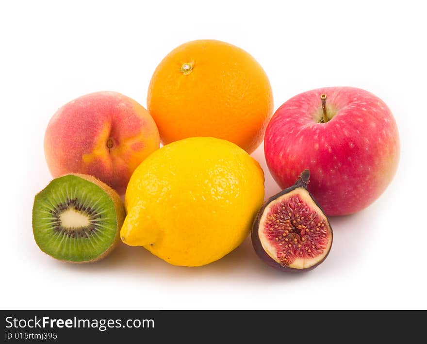 Beautiful peach apple fig lemon orange tasty and useful fruit on white background