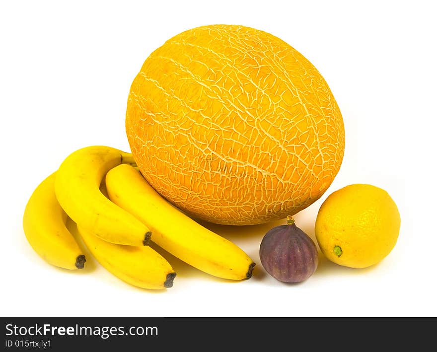 Fig bananas ripe tasty melon and yellow fruit with lemon on white background