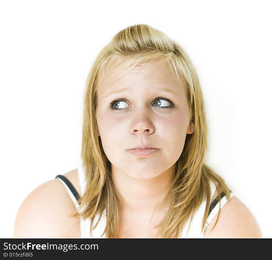 Young teenage girl looking to her right with a sad expression. Isolated on white background. See my portfolio for other expressions in this series. Young teenage girl looking to her right with a sad expression. Isolated on white background. See my portfolio for other expressions in this series.