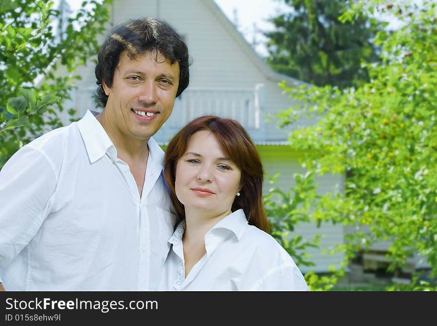 Portrait of young happy couple in summer environment