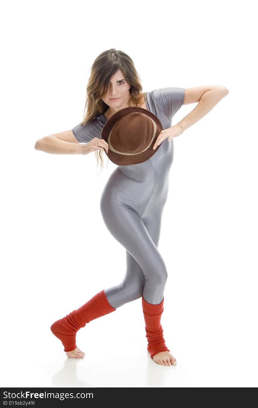 Woman posing with hat against white background