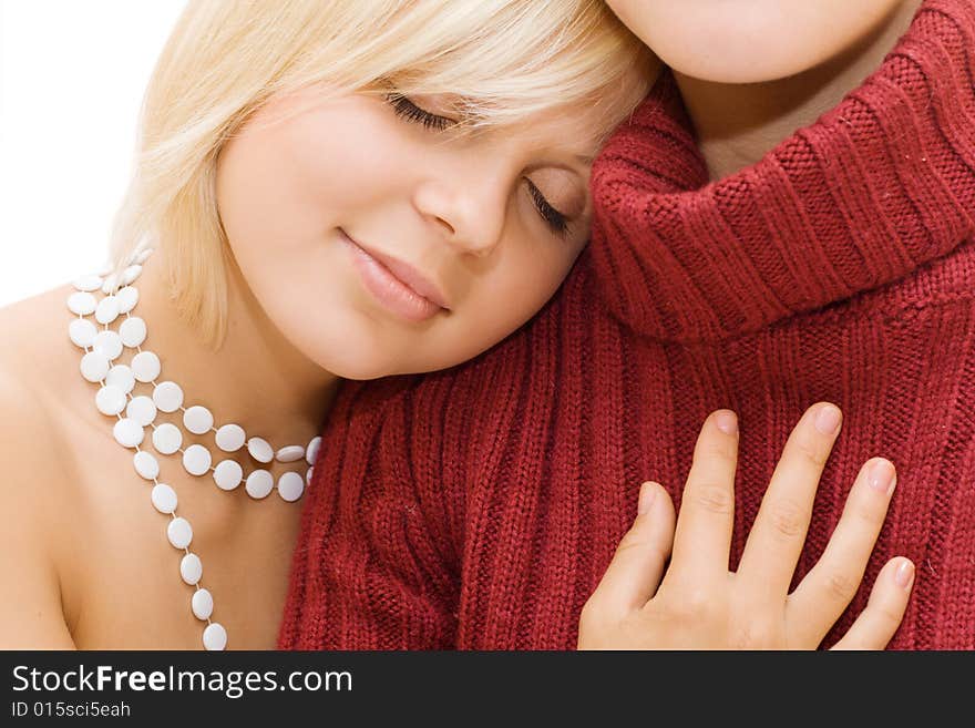 Beautiful blond girl head on friend's shoulder