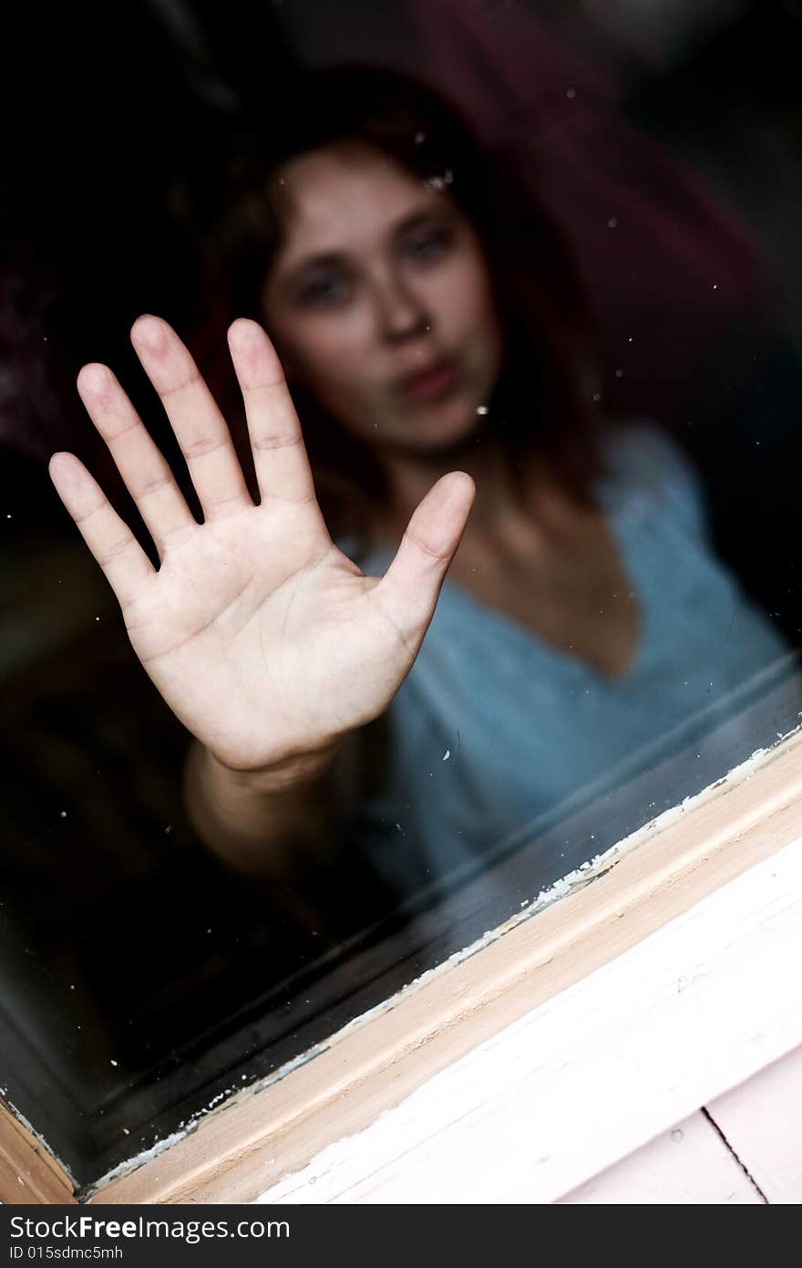 Nice woman stands outside the door. Nice woman stands outside the door.