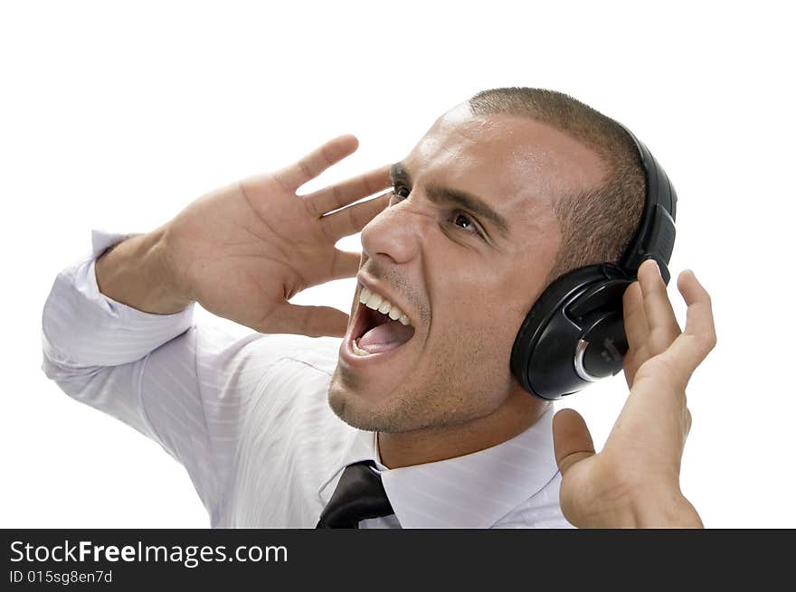 Shouting businessman with headphone on an isolated background