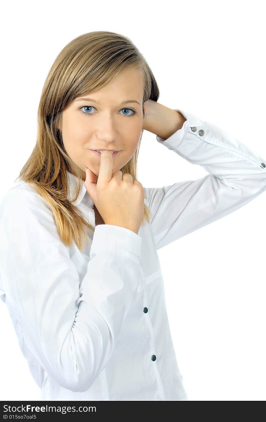 Beautiful fresh young girl bites her finger, isolated on white