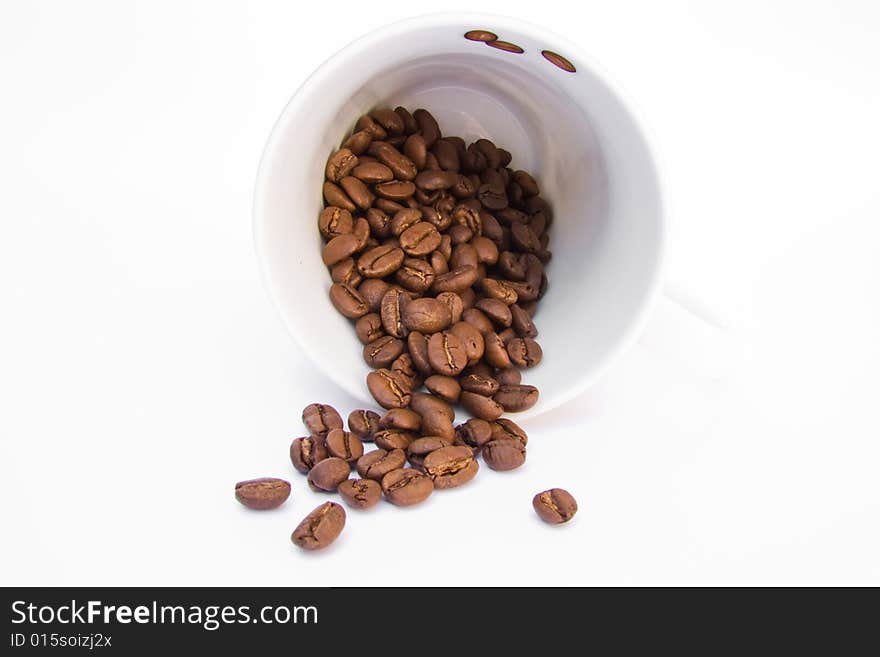 Coffee mug with beans on a white background