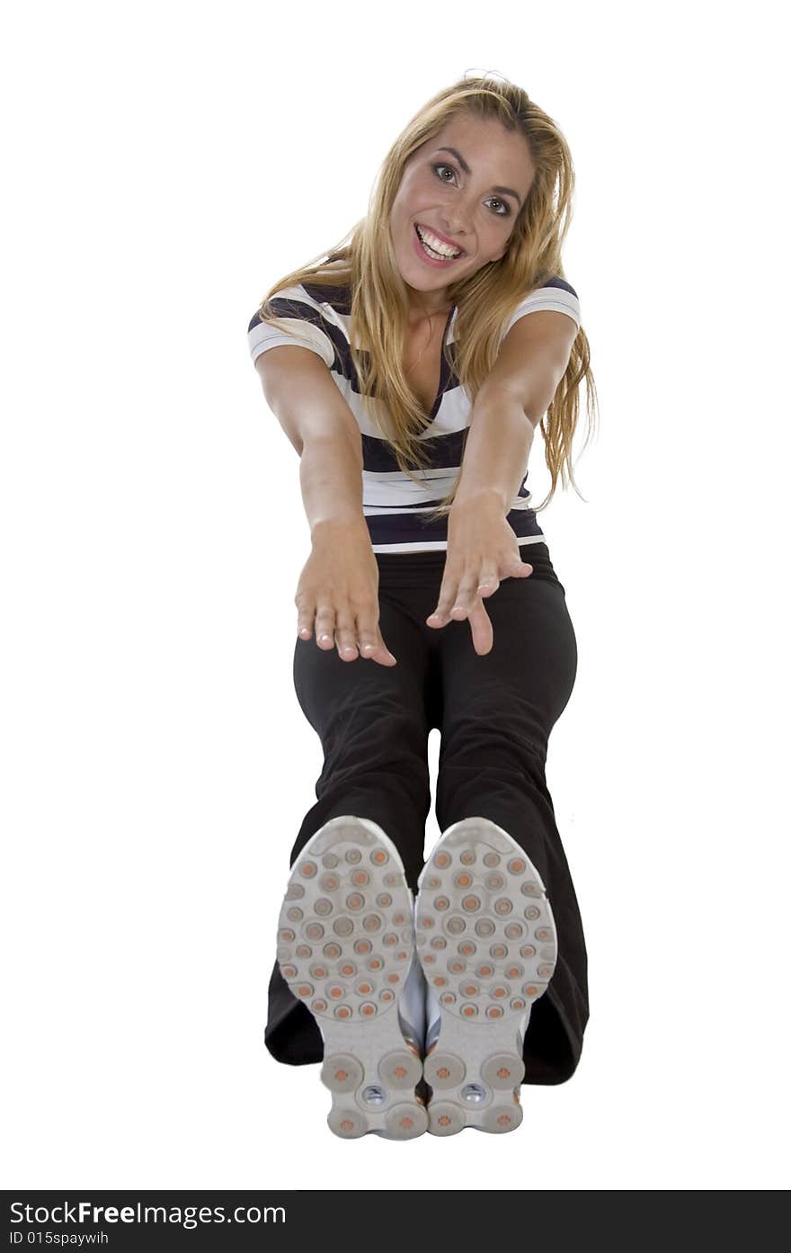 Blond lady stretching her hand some and feet on an isolated background. Blond lady stretching her hand some and feet on an isolated background