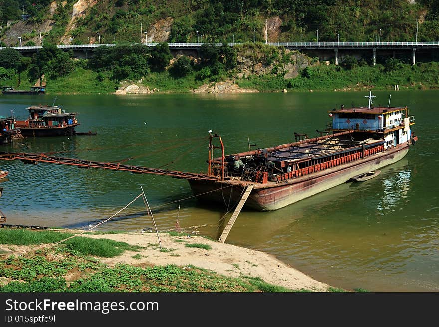 Boat docked in the small-clear, around the same green and matched the brilliance of nature.