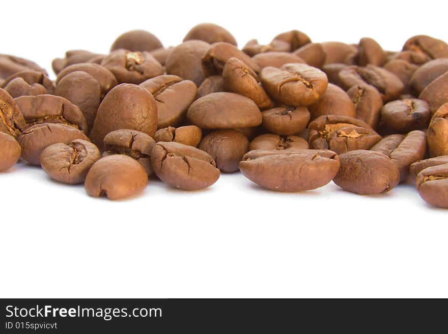 Lots of coffee beans on a white background