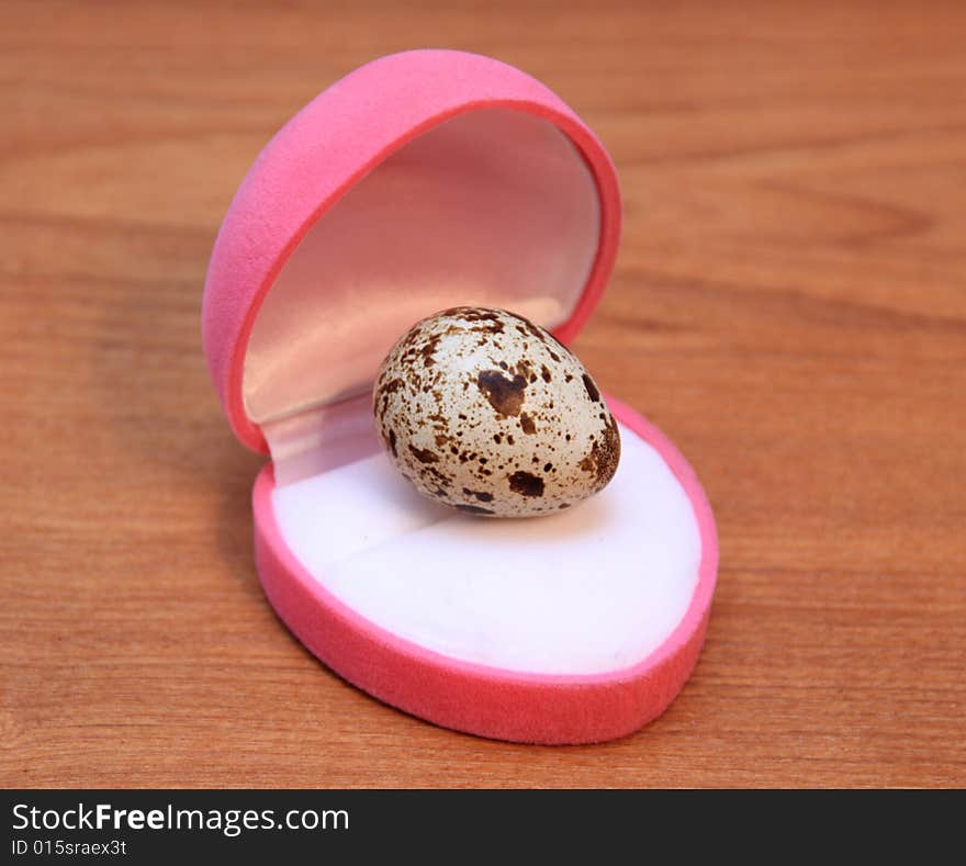 Quail egg on a wooden surface. Quail egg on a wooden surface