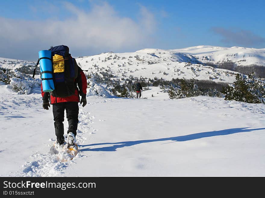 Backpacker in winter mountain, Crimea