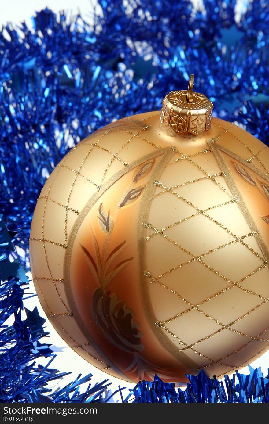 Golden bauble and blue chain , Christmas background