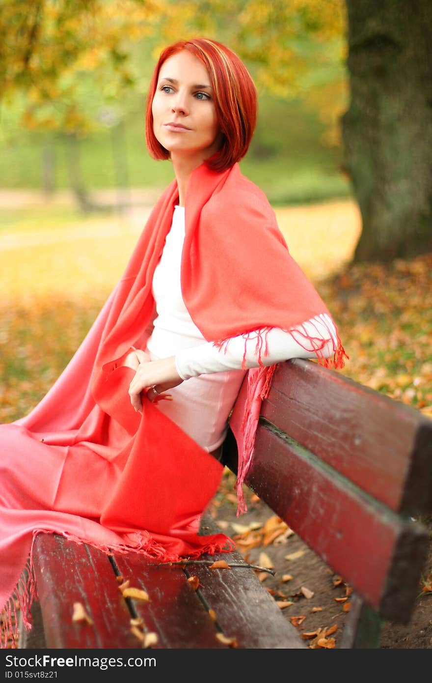 Young girl relaxing in autumn park. Young girl relaxing in autumn park