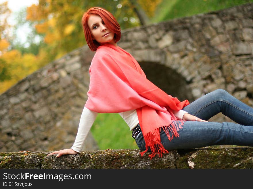 Young girl relaxing in autumn park. Young girl relaxing in autumn park