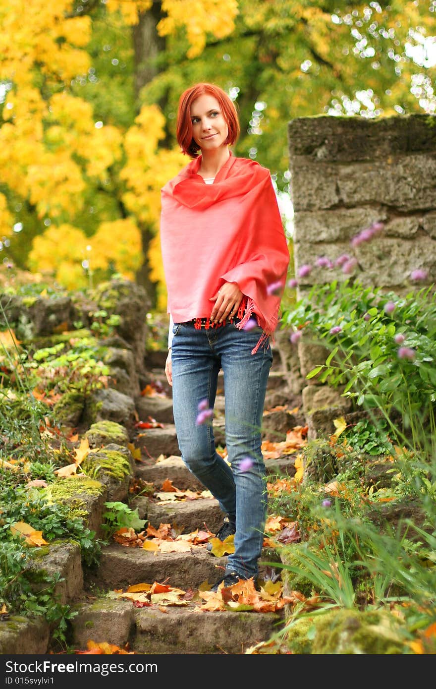 Young girl walking in autumn park. Young girl walking in autumn park