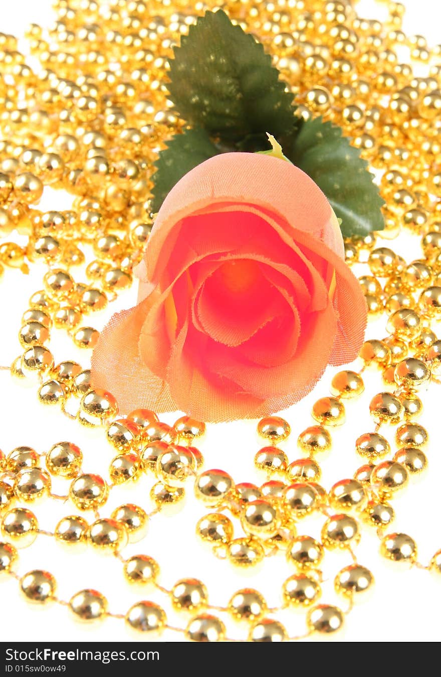 Plastic rose with the golden background. Plastic rose with the golden background