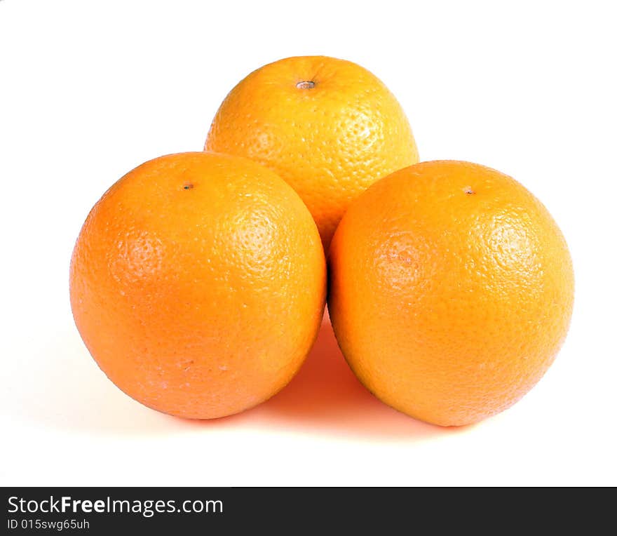 Three oranges on white background