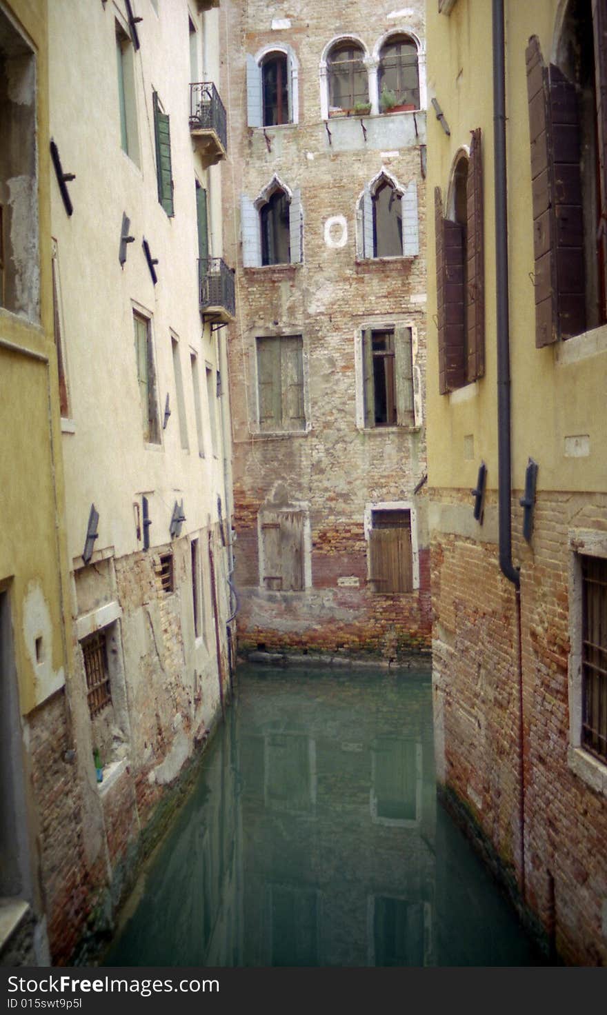 Quiet canal surrounded by residential buildings in Venezia, Italy. Quiet canal surrounded by residential buildings in Venezia, Italy