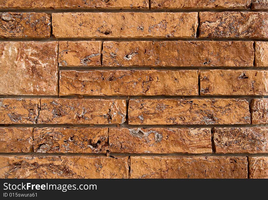 An ancient wall background made of red bricks