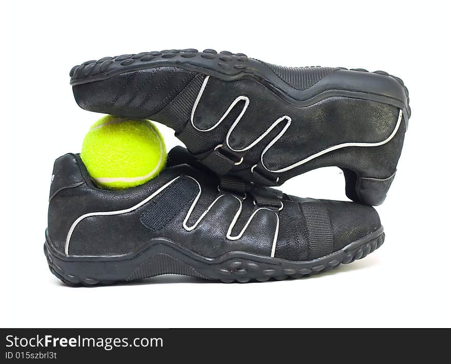 Black sport shoes and ball