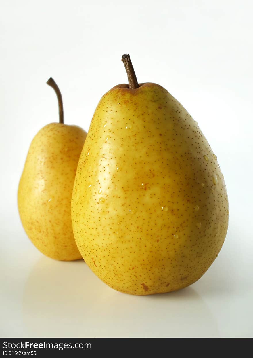 Two big yellow pears