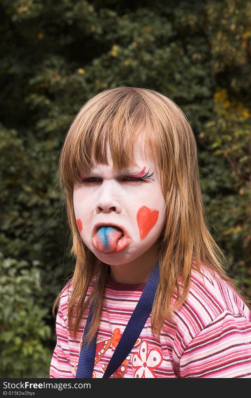 A little girl is making faces. A little girl is making faces