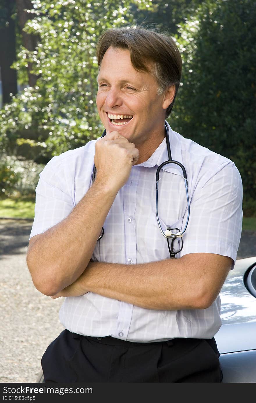 Handsome doctor in his forties is happy and smiling. Handsome doctor in his forties is happy and smiling