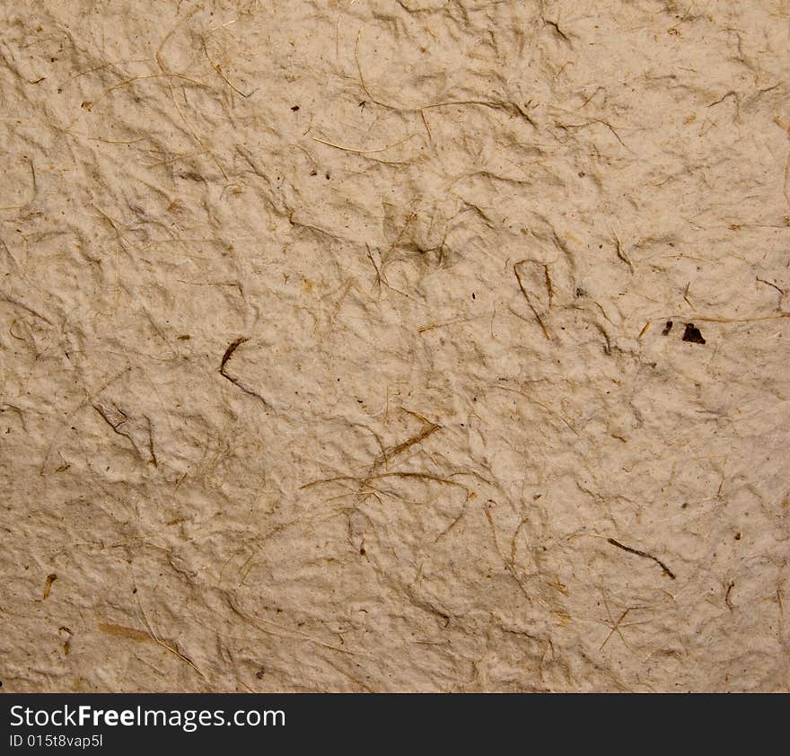 Rough textured crumbled paper with dark brown fibers. Rough textured crumbled paper with dark brown fibers