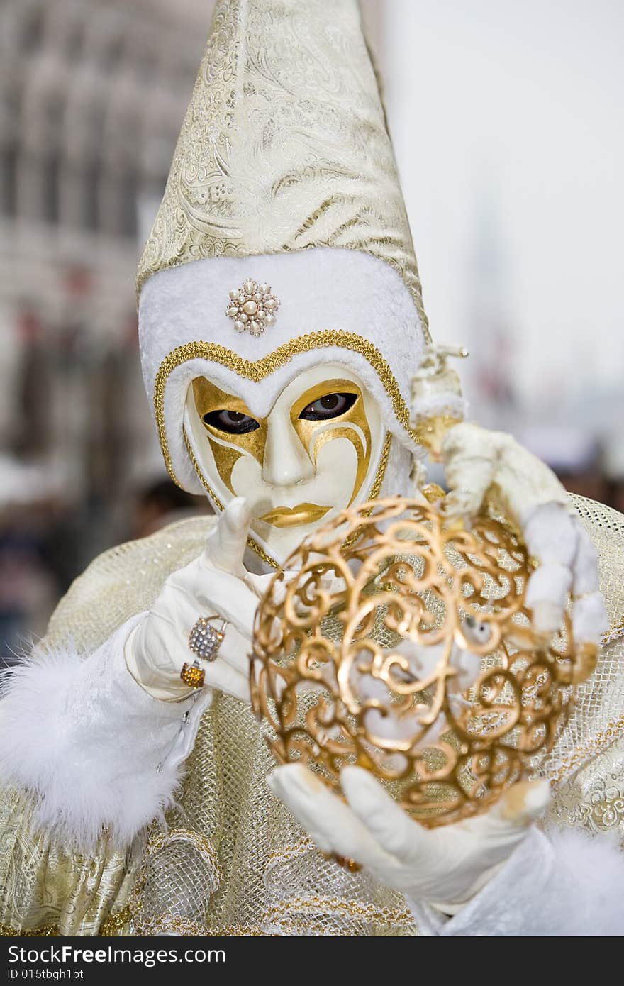 White and gold costume at the Venice Carnival. White and gold costume at the Venice Carnival