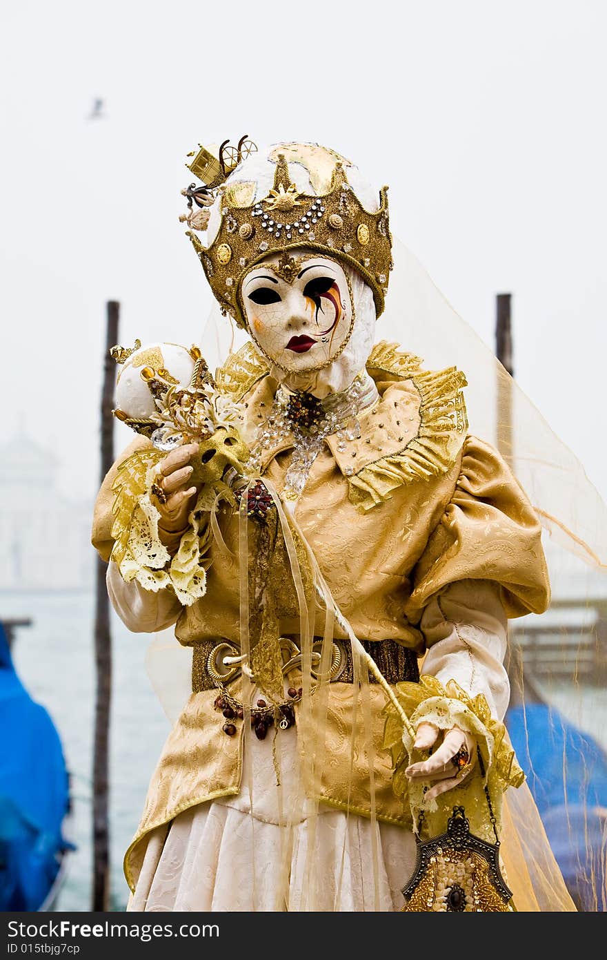 White and gold costume at the Venice Carnival. White and gold costume at the Venice Carnival