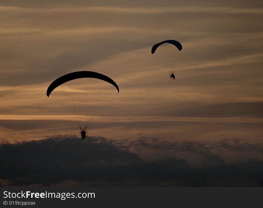 Paraglider Flight on dark cloudy. Paraglider Flight on dark cloudy