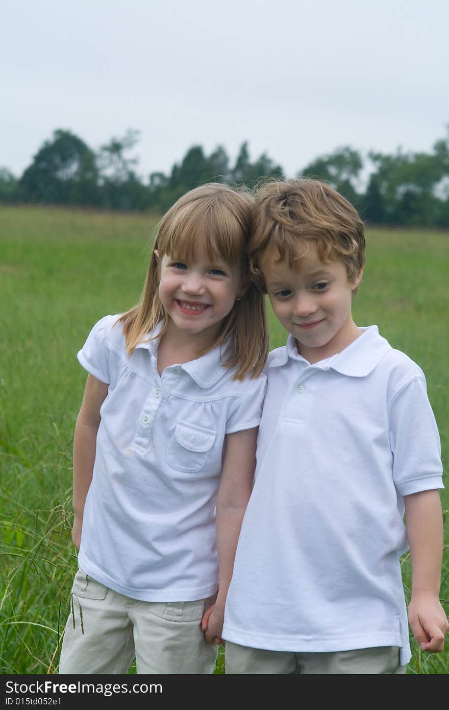 Boy girl twins out in the field. Boy girl twins out in the field