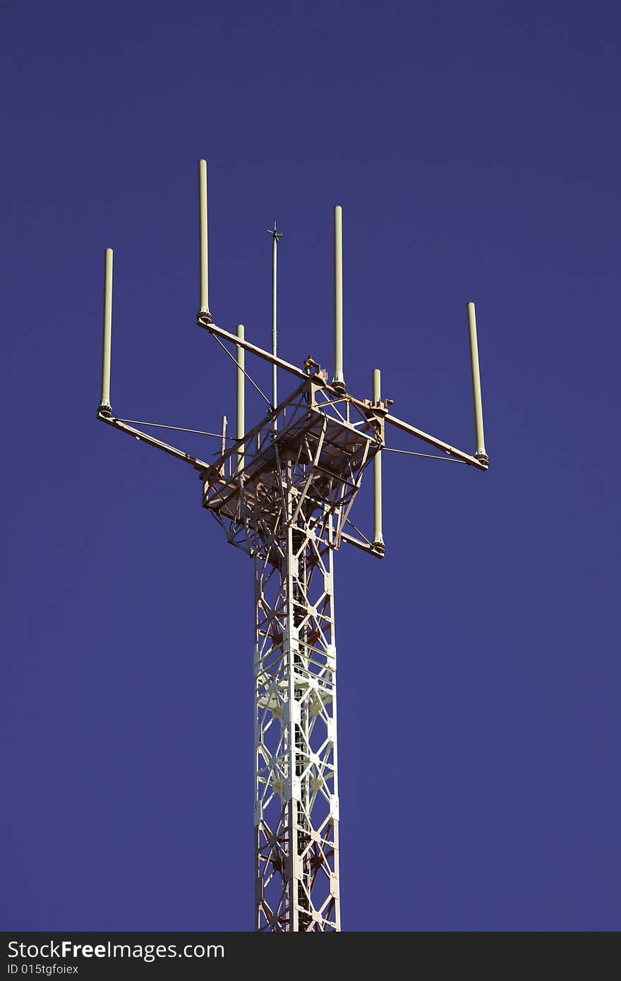 Telecommunications tower for broadcasting on perfect blue sky. Telecommunications tower for broadcasting on perfect blue sky