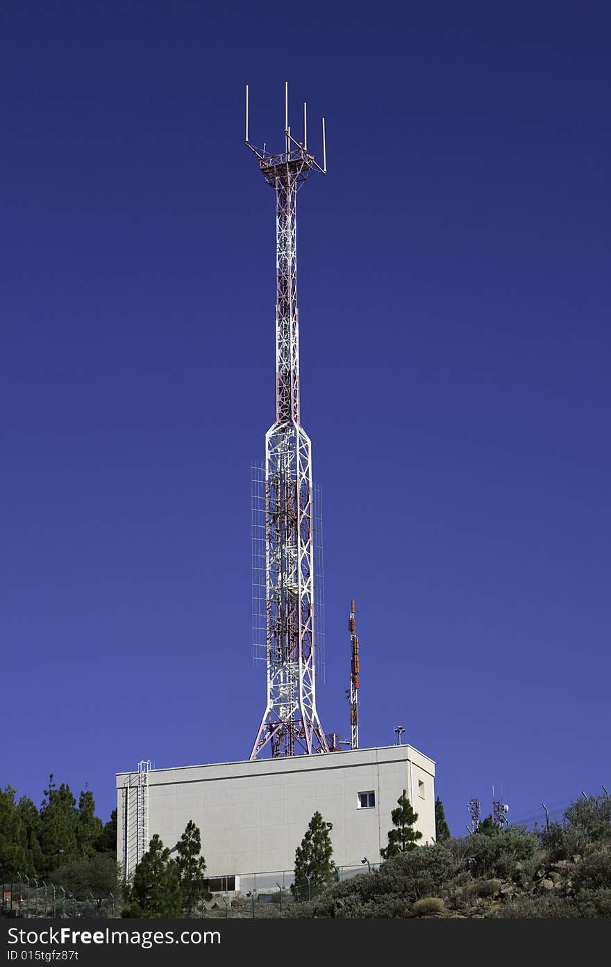 Telecommunications tower for broadcasting on perfect blue sky. Telecommunications tower for broadcasting on perfect blue sky