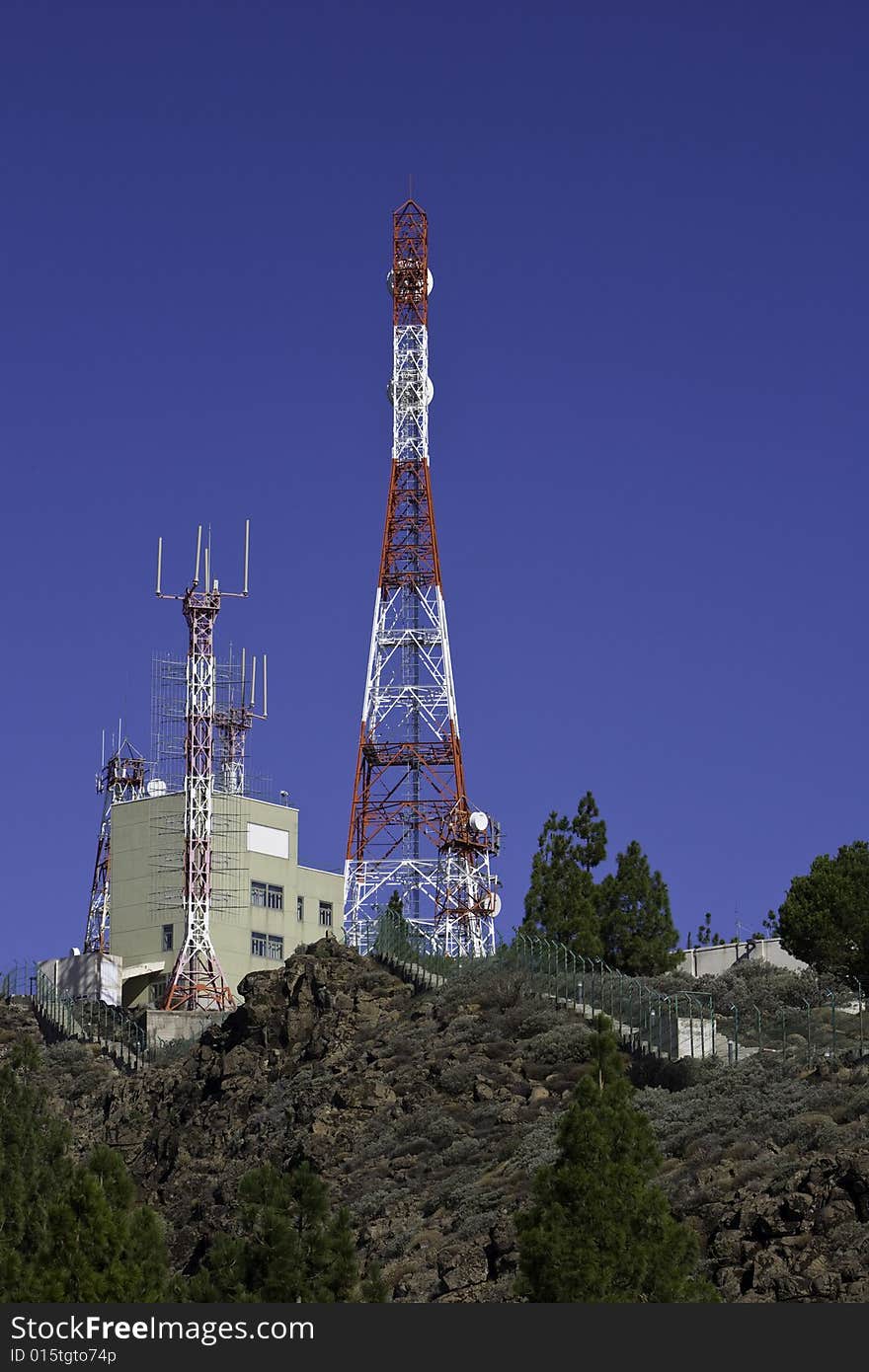 Telecommunications tower for broadcasting on perfect blue sky. Telecommunications tower for broadcasting on perfect blue sky