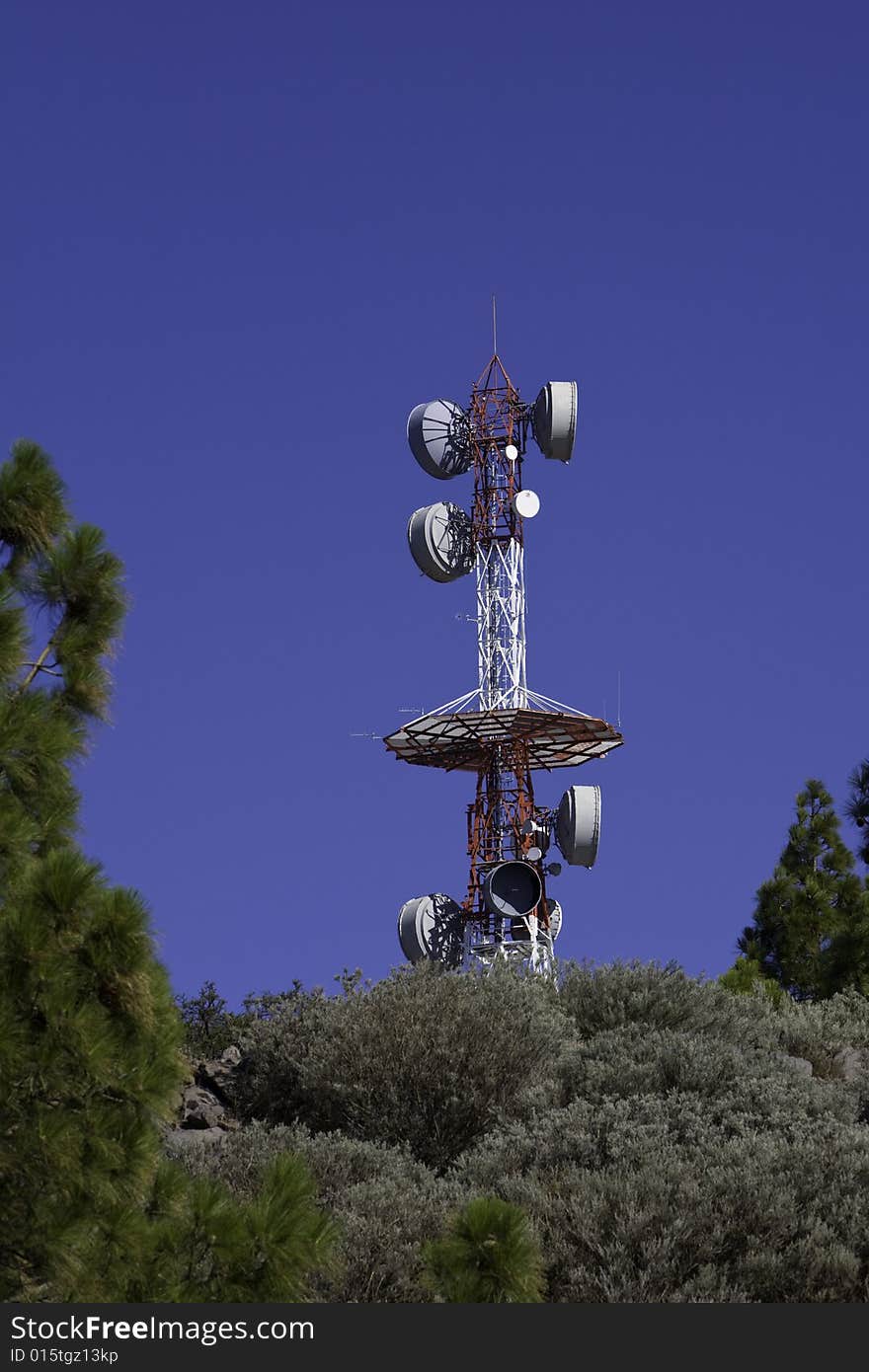 Telecommunications tower for broadcasting on perfect blue sky. Telecommunications tower for broadcasting on perfect blue sky