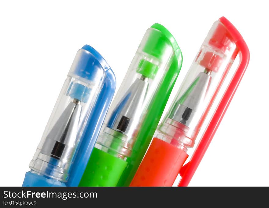 Red, blue and green pens on the white background. Red, blue and green pens on the white background