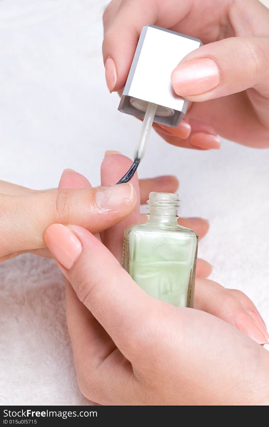 Applying manicure, moisturizing the nails