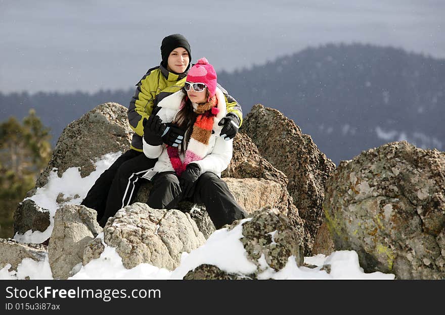 Happy young couple on the top of the mountain in winter. Happy young couple on the top of the mountain in winter