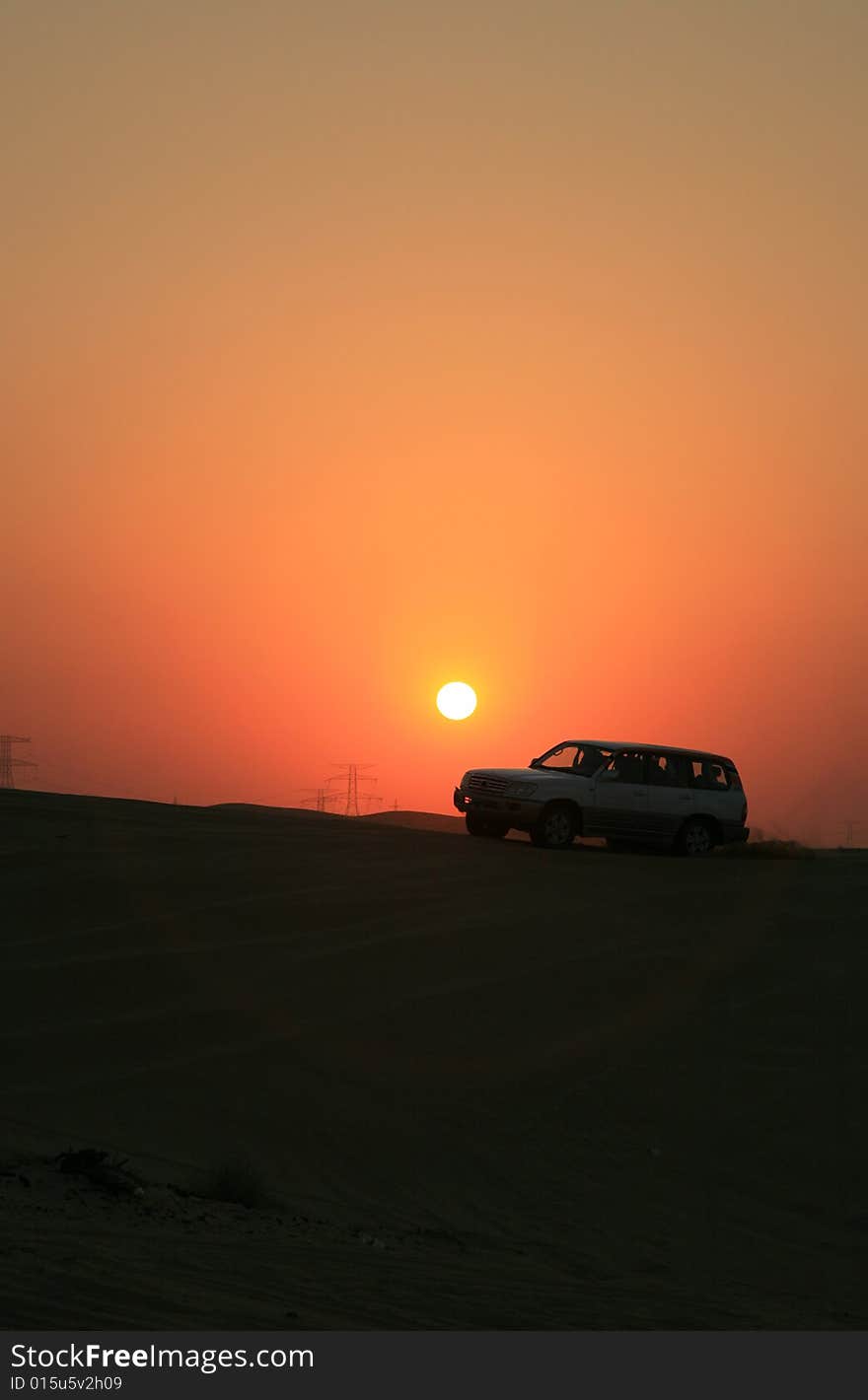 Vehicle Traveling in Sunset Glow