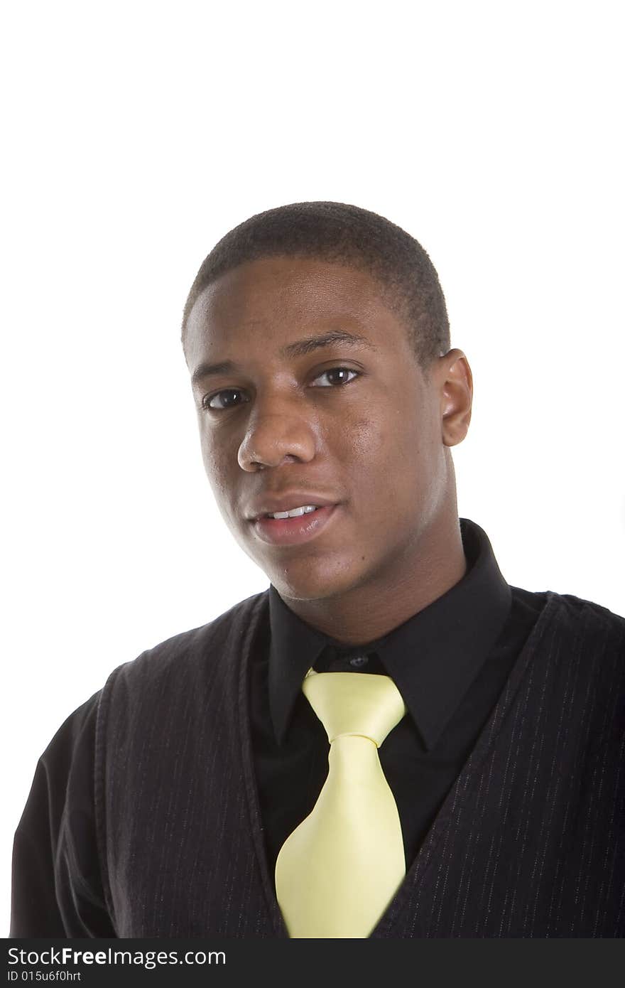 A handsome young black man in black shirt and sweater with a yellow tie. A handsome young black man in black shirt and sweater with a yellow tie