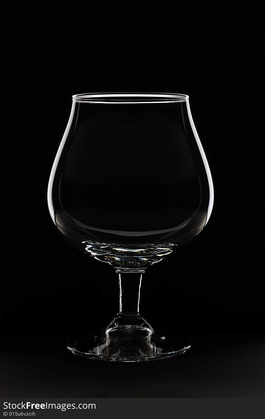 Empty glass against black background