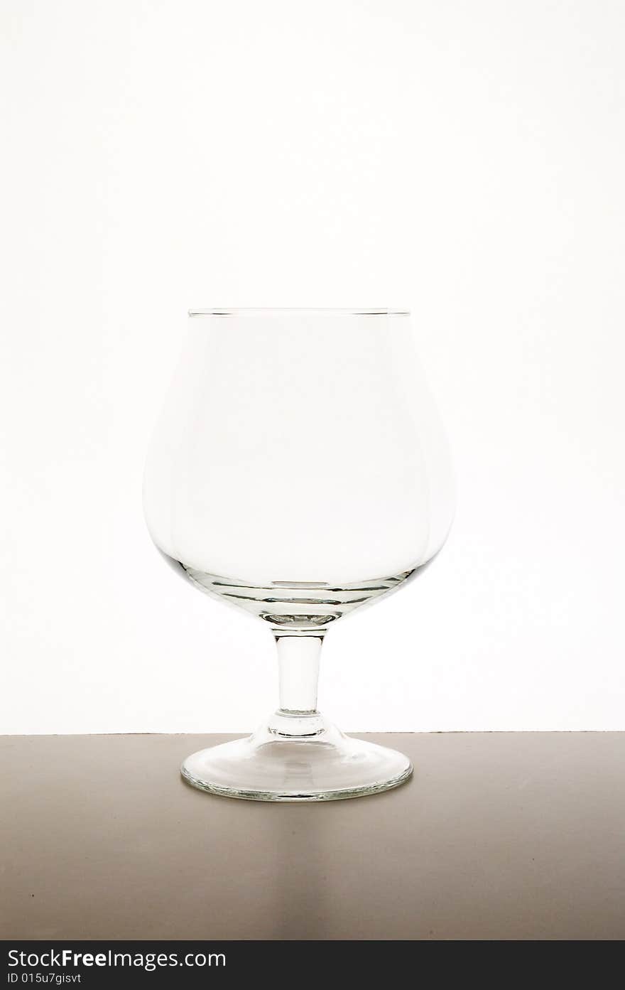 Empty glass against white background