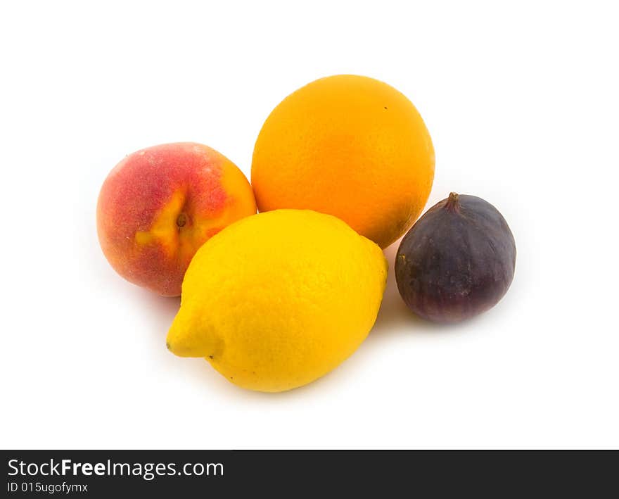 Peach and fig with orange and yellow lemon on white background