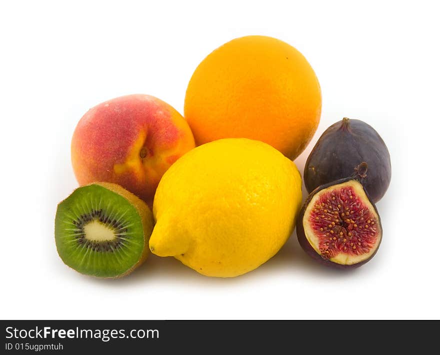 Yellow lemon and fig with other tasty fruit on white background