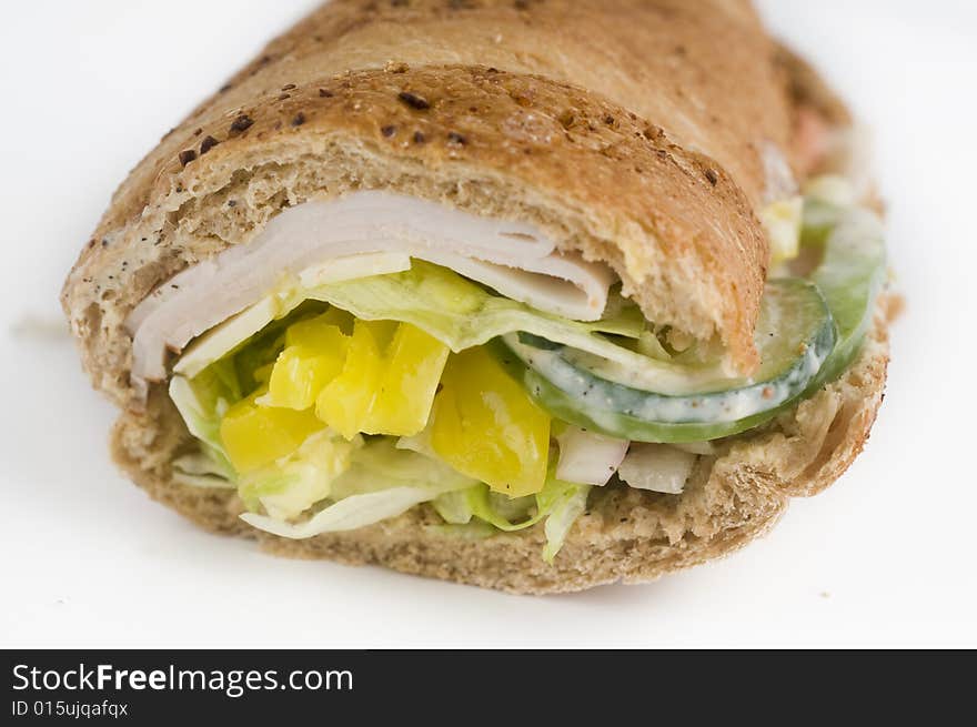 Healthy Turkey sandwich set against white background