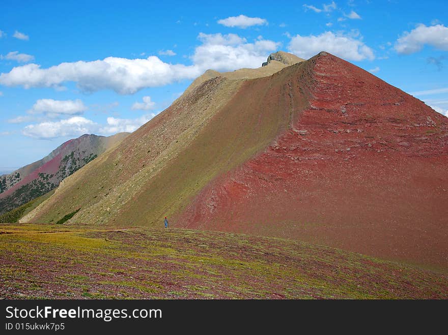 A red color mountain peak on Carthew-Alderson Trail in Waterton National Park Alberta Canada. A red color mountain peak on Carthew-Alderson Trail in Waterton National Park Alberta Canada