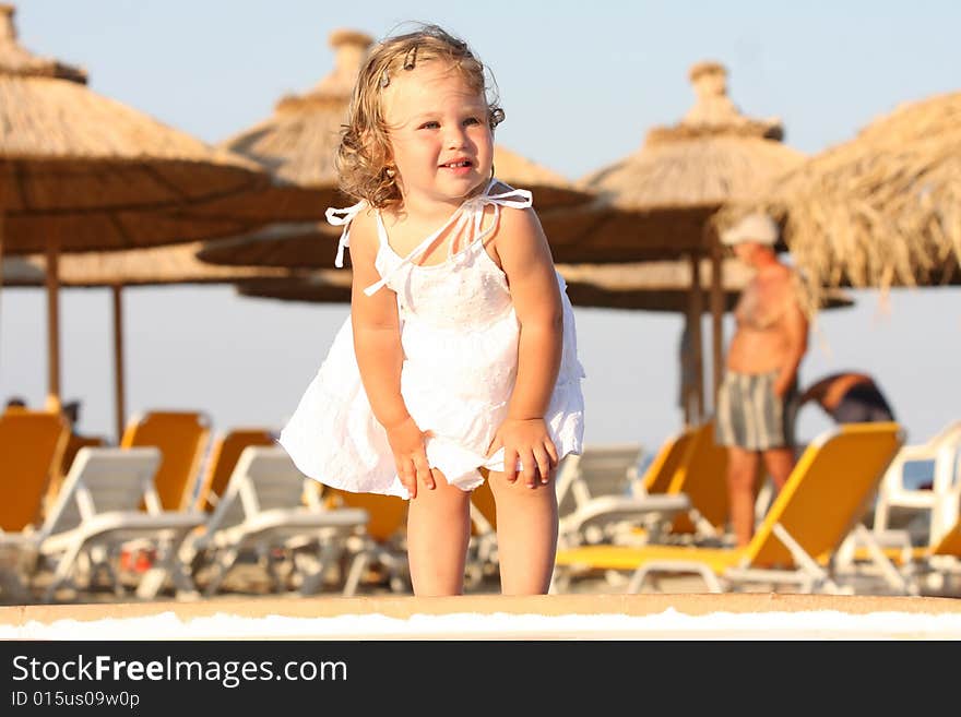 Beauty a little girl at beach in the sea