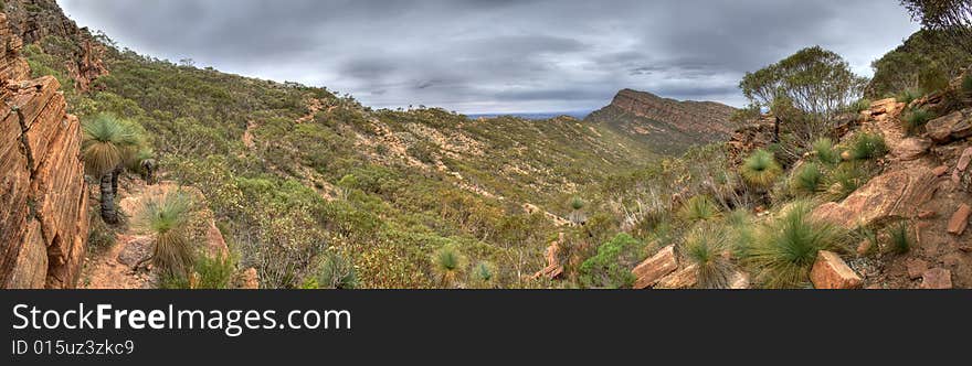 A moody, overcast sky above the mountainous St. Mary’s Ridge, Wilpena Pound, Flinders Ranges National Park, South Australia. A moody, overcast sky above the mountainous St. Mary’s Ridge, Wilpena Pound, Flinders Ranges National Park, South Australia.