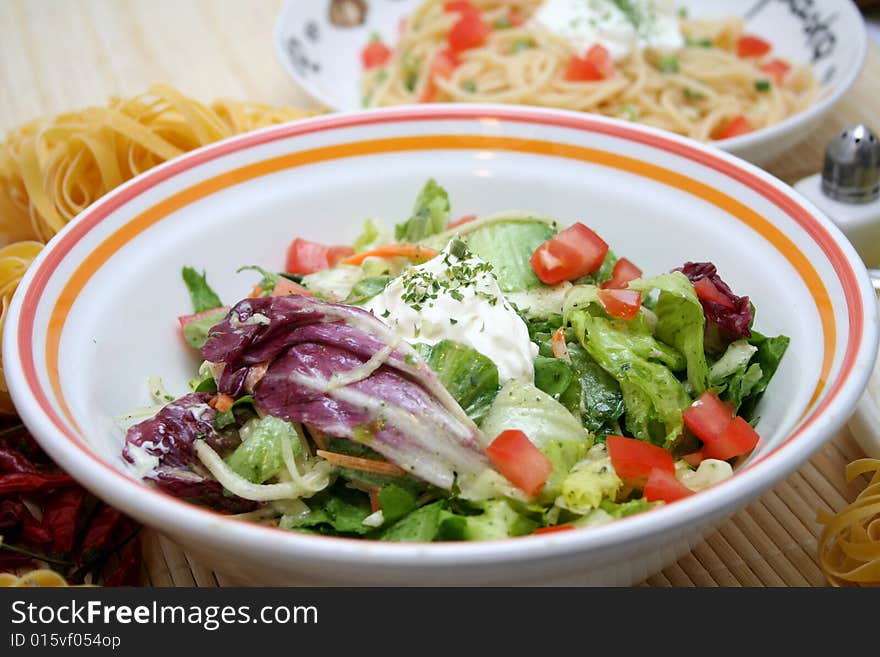 A fresh mixed salad with oil and spices